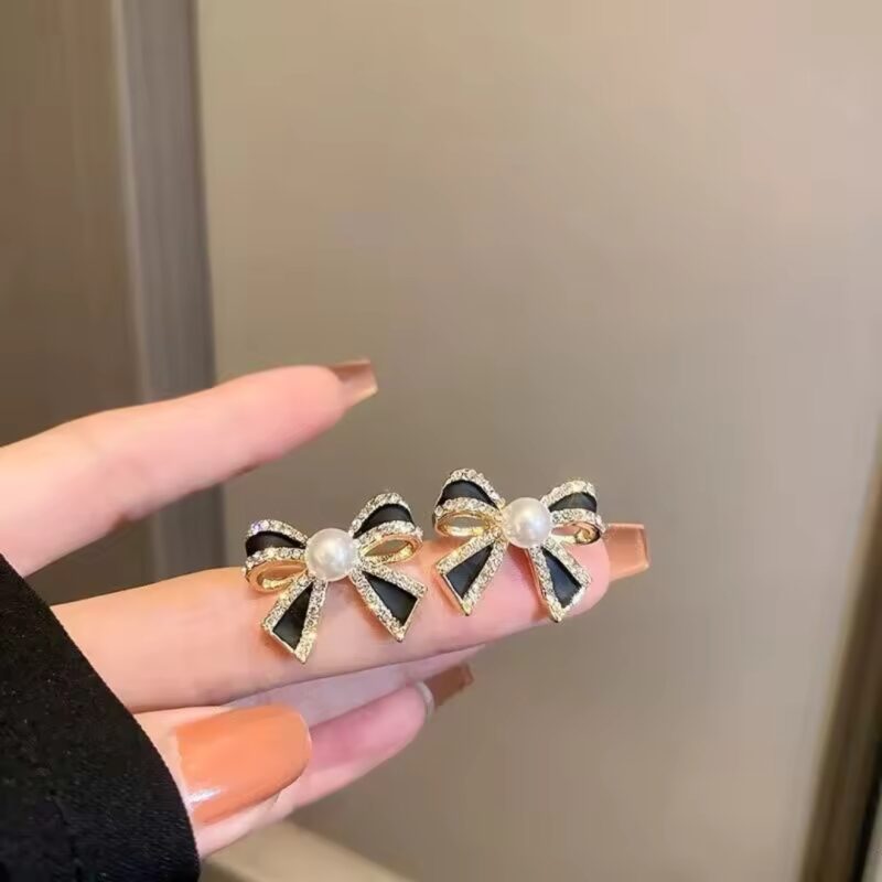 Mikimoto Pearl Bow Stud Earrings.