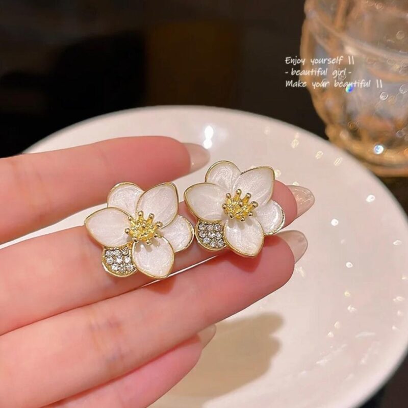 JJK 31  Gold-Plated Artificial Stone Studded Floral Stud Earrings.