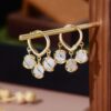 JJK 11 Korean-style gold-plated hoop earrings with dangling white stone or pearl charms,