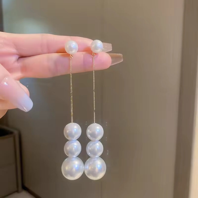 Long Pearl Drop Dangle Earrings.