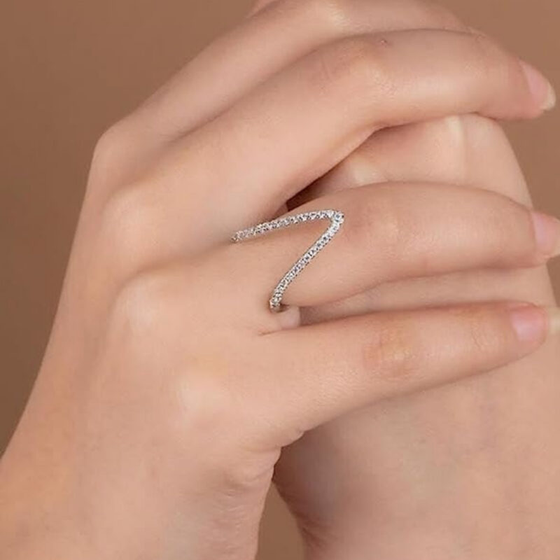 V-shaped ring adorned with cubic zirconia stones. - Image 2
