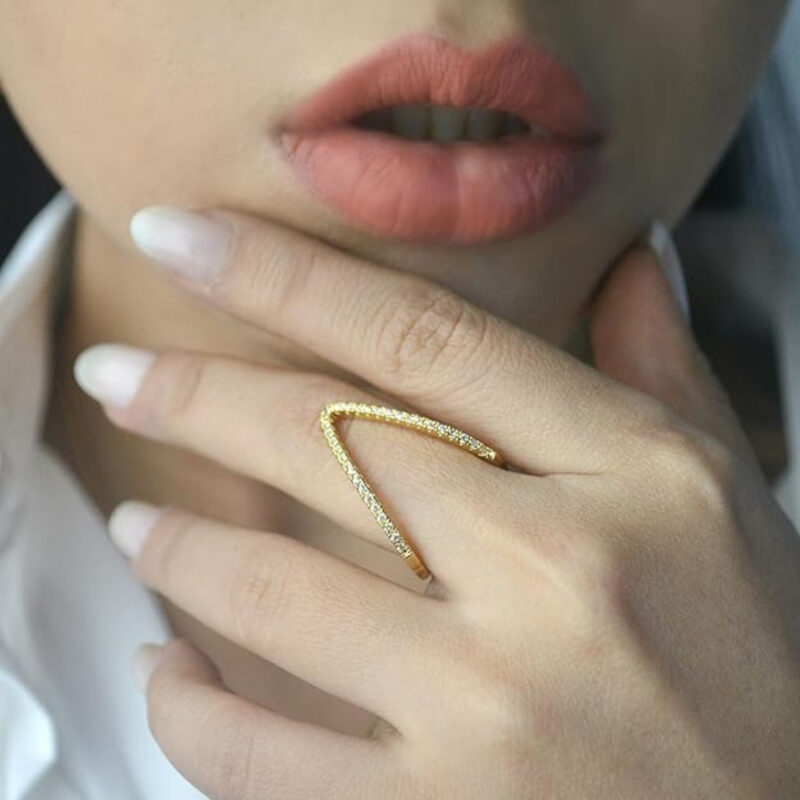 V-shaped ring adorned with cubic zirconia stones. - Image 4