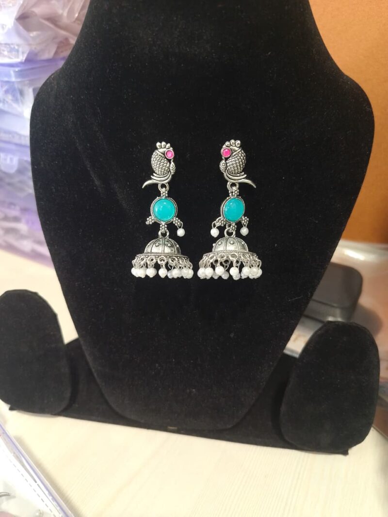 oxidized silver peacock jhumka earrings with turquoise stones and white pearl embellishments. - Image 3