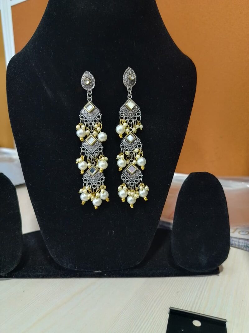 oxidized silver jhumka earrings with pearl drops.