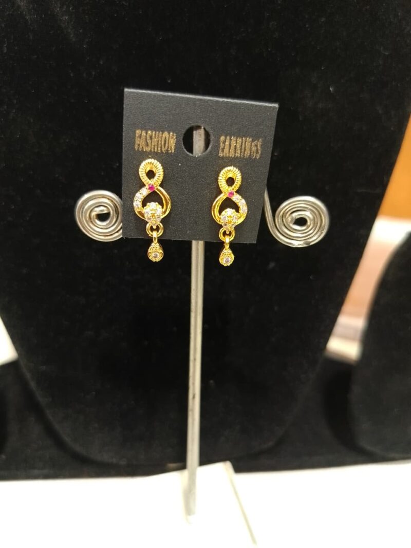gold-plated fashion earrings featuring a distinctive design with red and white American Diamond or Cubic Zirconia stones