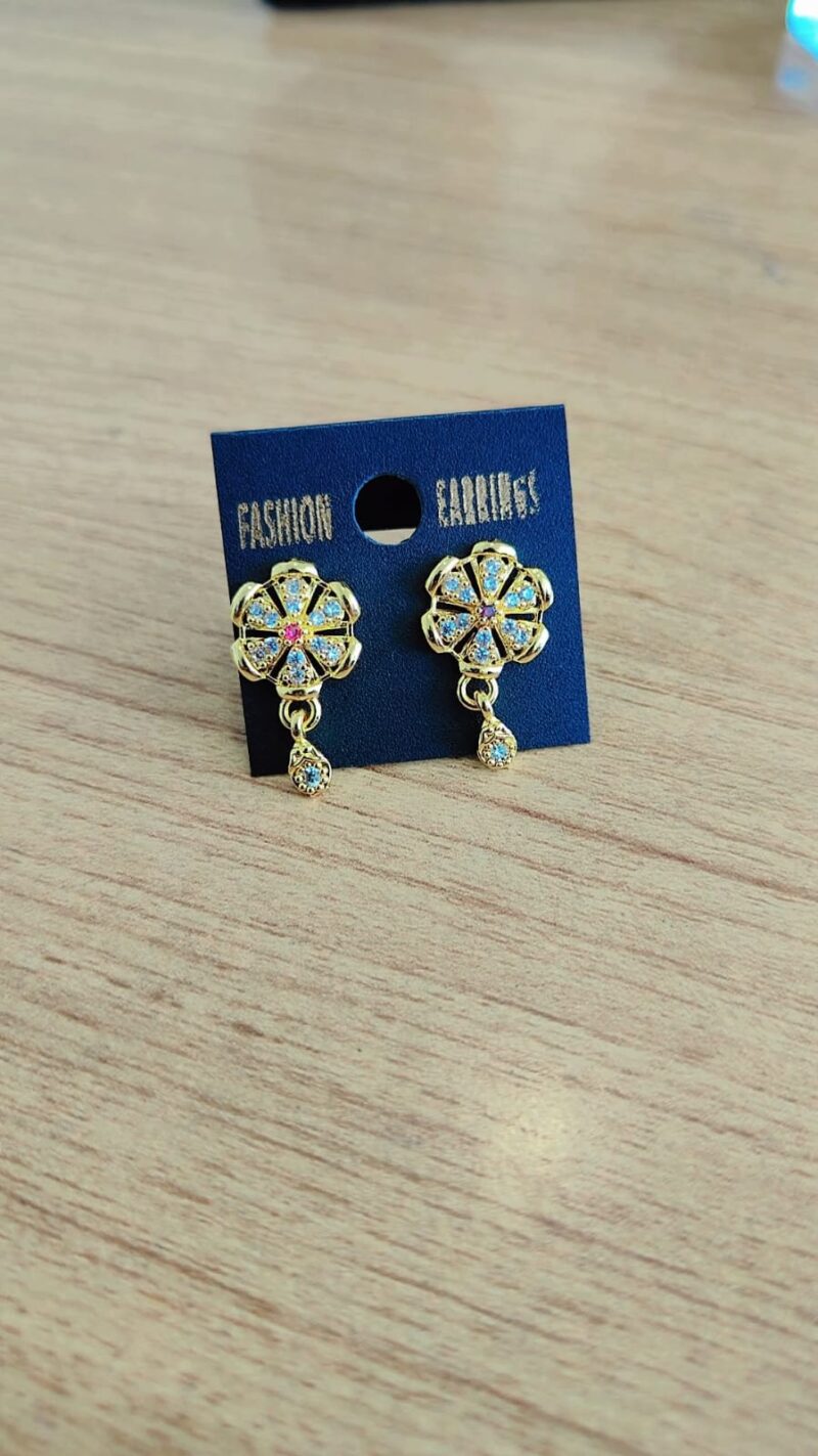 gold-toned flower-shaped stud earrings adorned with colorful stones,