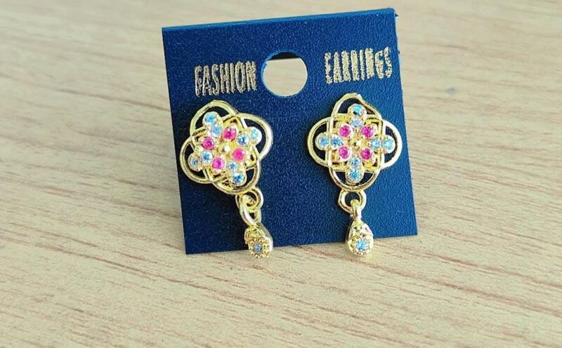 gold-toned fashion earrings featuring a floral or clover-like design with pink and blue stones