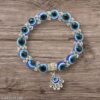 Evil Eye bracelet with a Hamsa Hand charm.
