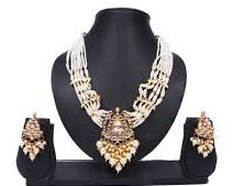 traditional Indian pearl and kundan necklace set with matching earrings