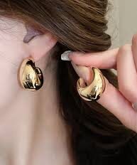 gold-plated teardrop hoop earrings.