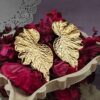 gold-plated leaf-shaped earrings [1.0].