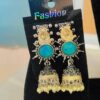 This is a pair of oxidized silver jhumka earrings with a turquoise stone and pearl drops.